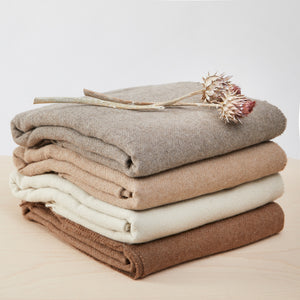 Lamadeckenn stacked in 4 natural colours .