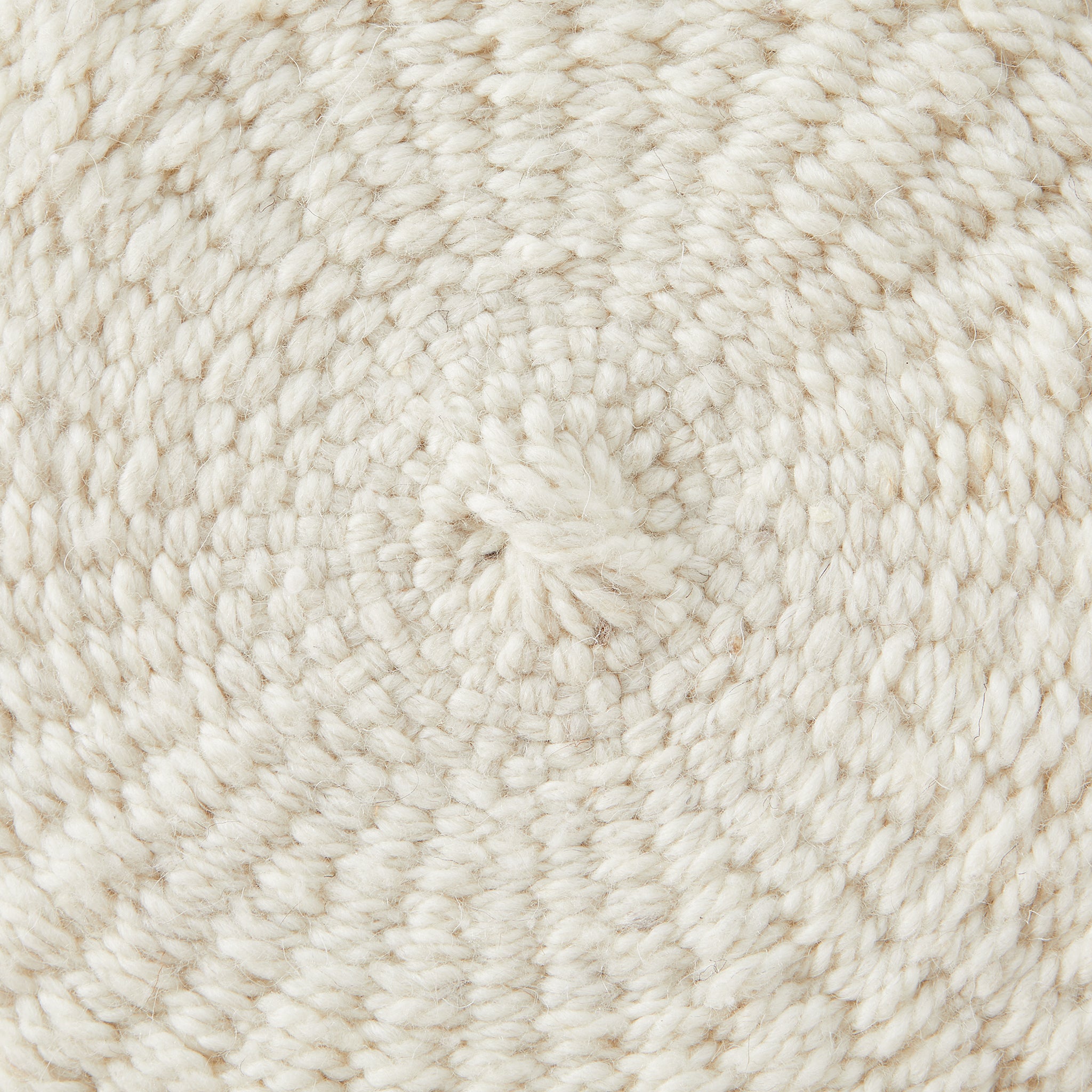 Detail woven structure pom pom cushion.