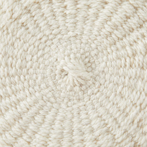 Detail woven structure pom pom cushion.