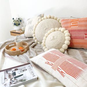 PomPom Pillows in S and L bedroomshot close up.