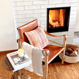 Safari armchair by the fireplace- By Native